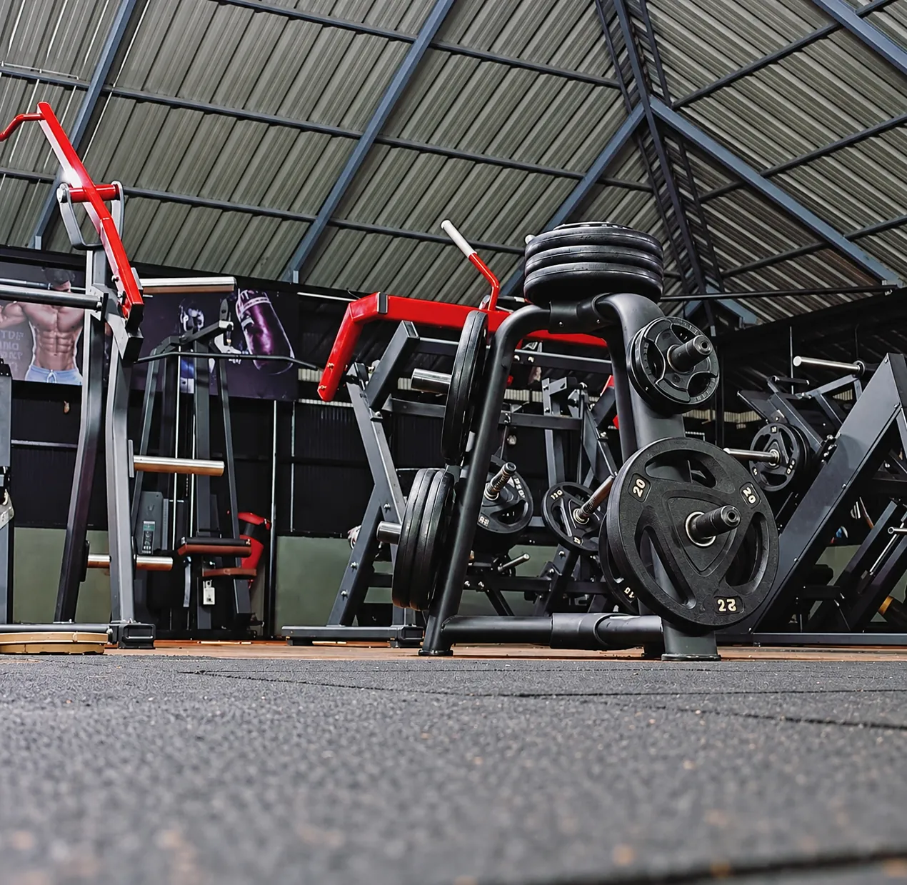 Plate-loaded machines and weight plates at the Kottarakkara gym